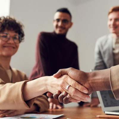 Shaking hands after being hired for a job